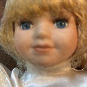 Porcelain Doll in White Satin Dress